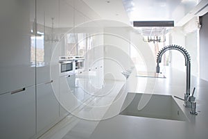 Modern white kitchen perspective with integrated bench