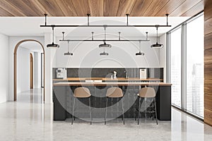Modern white kitchen with stylish black breakfast bar