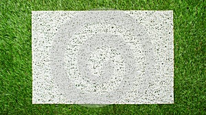 Modern white mat on green grass background