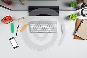 Modern White office desk table with computer,smart phone photo