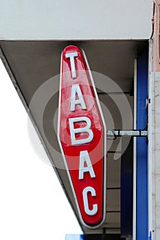 Modern White And Red Tabac Sign On Wall photo