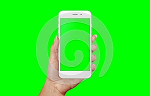 Modern white smart phone in woman hand. Isolated screen and background in green