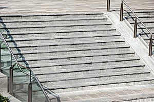 Modern white stair up to the square in the urban city.