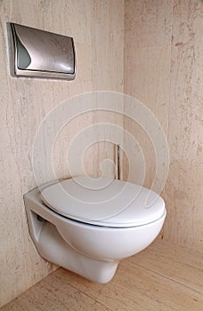 Modern white toilet in a luxury marble bathroom