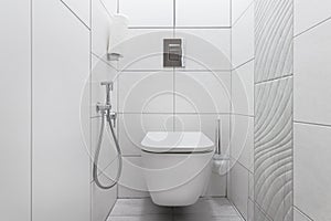 Modern white toilet with toilet and hygienic shower