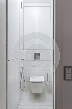 Modern white toilet with toilet and hygienic shower