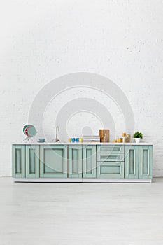Modern white and turquoise kitchen interior