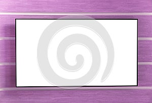 Modern widescreen TV with blank empty white isolated screen hanging on the wall. Black LED tv television mockup blank on pink