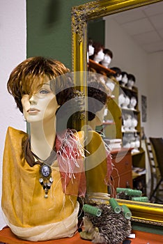 Modern wig on a dummy in a shop