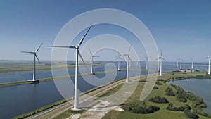 A Modern Wind Farm consisting of Wind Turbines with Two and Three Blades along the Shore of Veluwemeer under Partly Cloudy and