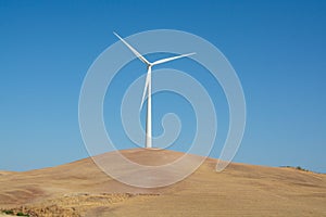 Modern wind mill and yellow fields in Andalusie, Spain