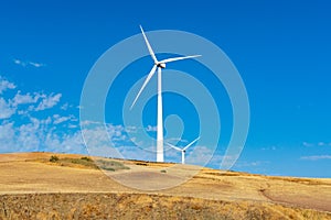 Modern wind mill and yellow fields in Andalusie, Spain