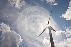 Modern wind turbine against sky, low angle view. Alternative energy source