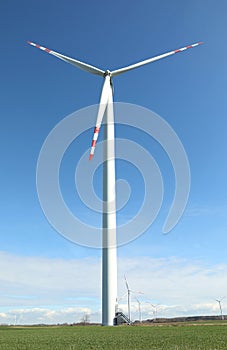 Modern wind turbine in field. Alternative energy source