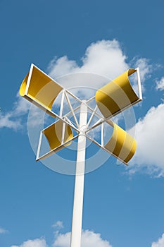 Modern wind turbine made from yellow steel