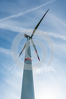 Modern wind turbine, view from low angle during daylight