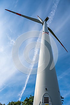 Modern wind turbine, view from low angle during daylight