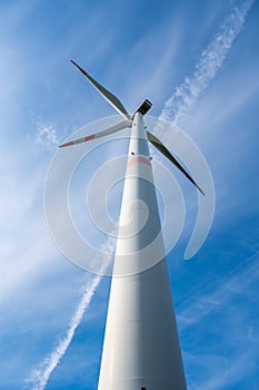 Modern wind turbine, view from low angle during daylight