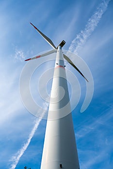 Modern wind turbine, view from low angle during daylight