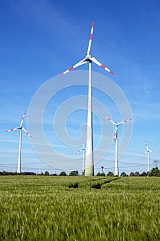 Modern wind turbines on a sunny day