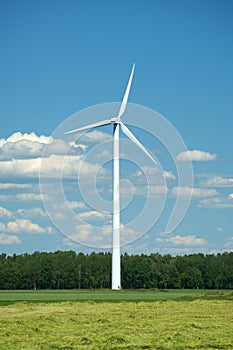 Modern windmill on field