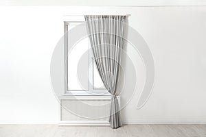 Modern window with curtains in room