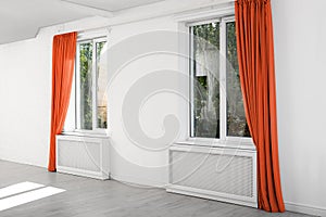 Modern windows with curtains in room