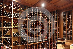 Modern wine storage cellar in a restaurant or house with bottles and corks. Sommelier concept.