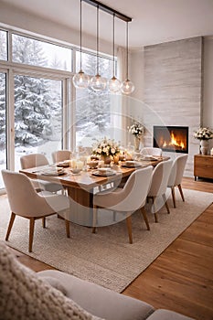 Cozy Winter Dining Room with Fireplace and Snowy Forest View