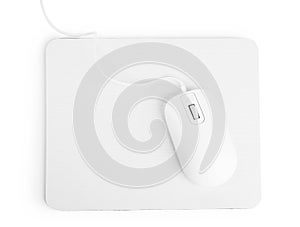 Modern wired mouse and pad isolated on white