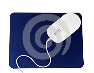 Modern wired optical mouse and blue pad isolated on white