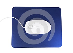 Modern wired optical mouse and blue pad isolated, top view