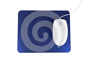 Modern wired optical mouse and blue pad on white, top view