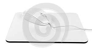 Modern wired optical mouse and pad on white