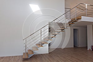 modern wood stairs in the hollway in a big private house