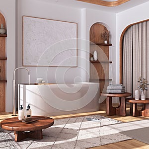 Modern wooden bathroom with curtains, bathtub, tables and carpets in white and beige tones. Parquet floor and arched door. Japandi