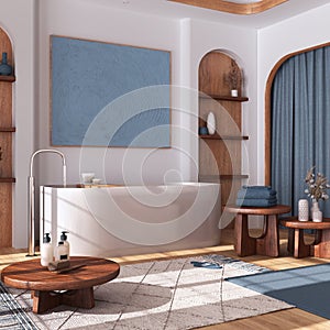 Modern wooden bathroom with curtains, bathtub, tables and carpets in white and blue tones. Parquet floor and arched door. Japandi