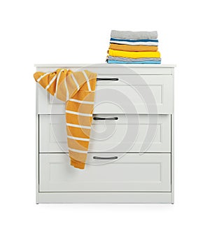 Modern wooden chest of drawers with clothes