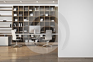 Modern wooden and concrete library office interior with blank mock up place on wall, furniture and decorative plant.