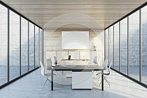 Modern wooden and concrete meeting room interior with panoramic glass windows, table with devices and empty white mock up poster