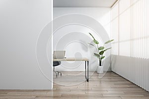 Modern wooden and concrete office interior with blank white mock up place, workplace desk, laptop, chair, decorative plant, blinds