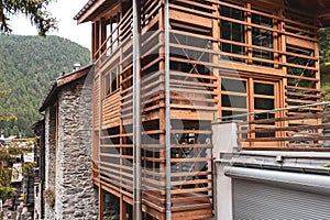 Modern wooden facade made of slats. authentic architecture of Switzerland.