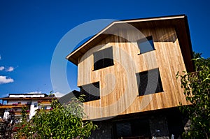 Modern wooden house in Italian Alps