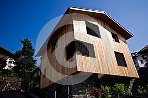 Modern wooden house in Italian Alps