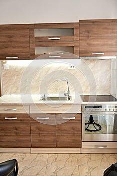 Modern wooden kitchen interior with lights