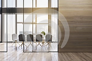 Modern wooden meeting room office interior with empty mock up place on wall, table, armchairs, window with city view and daylight