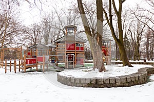 Modern wooden playground for young children during winter season