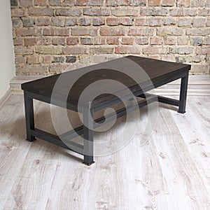 Modern wooden table in the loft interior