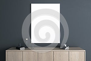 Modern wooden TV shelf with items and empty white mock up banner on dark wall background. Interior design and living room with