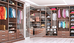 Modern wooden wardrobe with clothes hanging on rail in walk in closet design interior. photo
